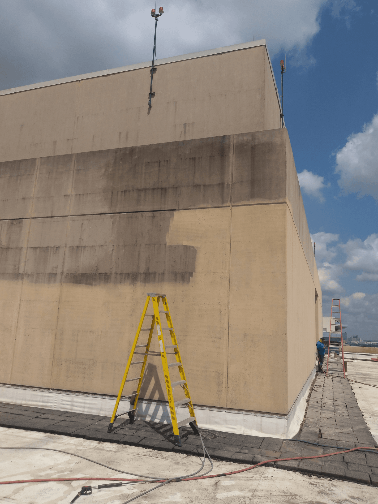 Treated and re-coated commercial exterior wall